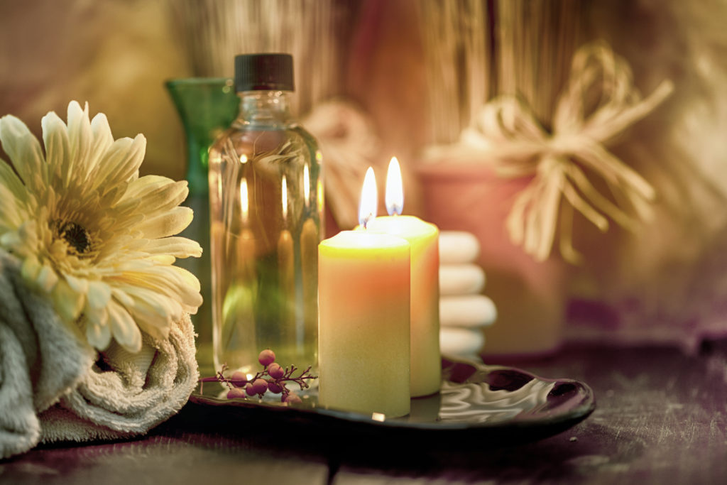 candles and essential oils used in aromatherapy
