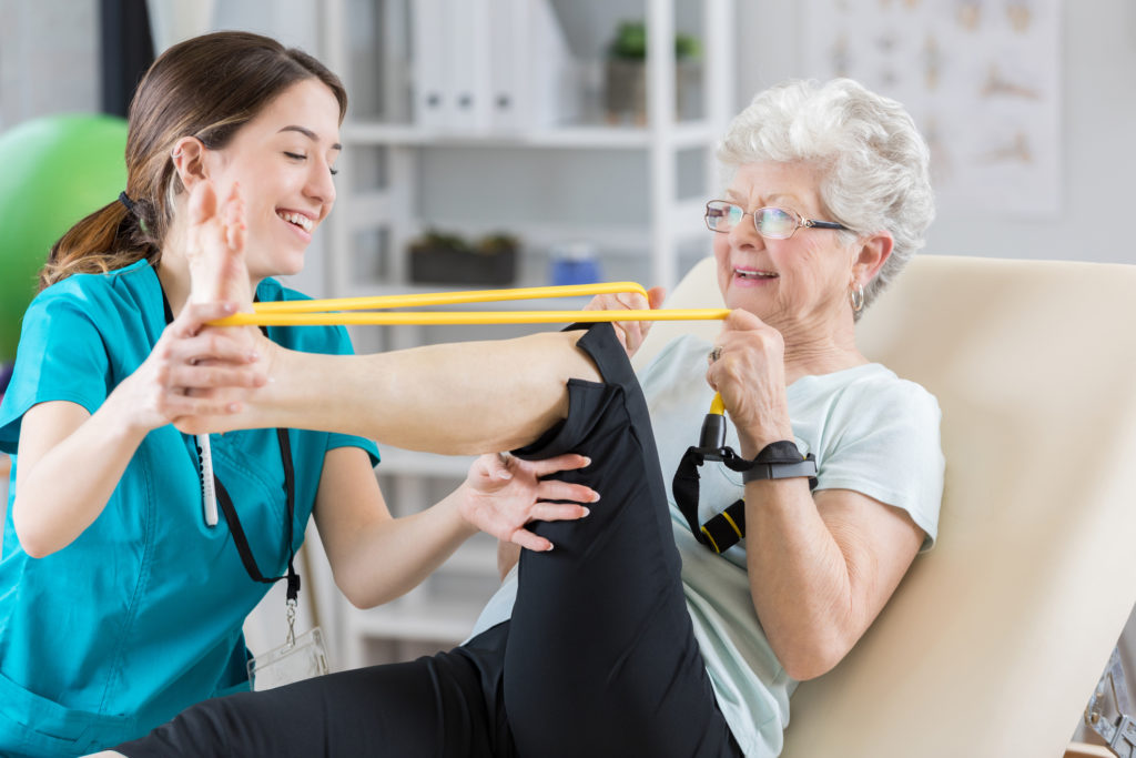elderly woman in physical therapy