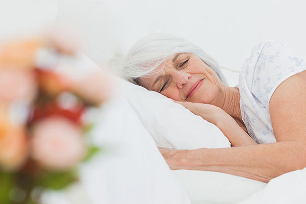 senior woman sleeping in bed